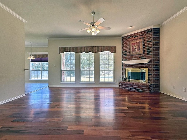 unfurnished living room with a fireplace, crown molding, ceiling fan, and dark wood-type flooring