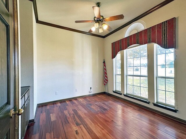 unfurnished room featuring ceiling fan, crown molding, and dark wood-type flooring