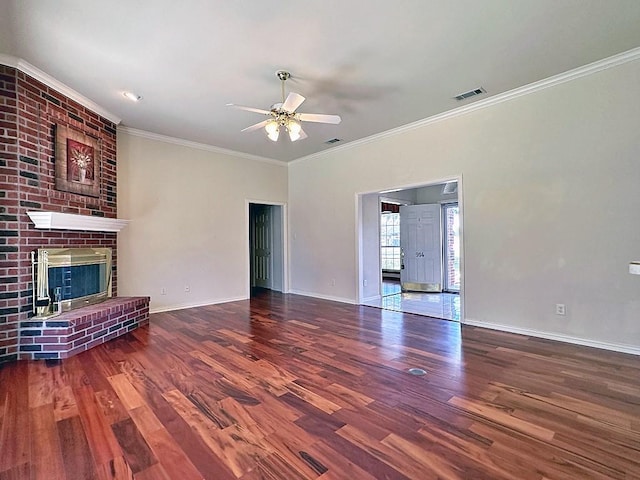 unfurnished living room featuring crown molding, hardwood / wood-style floors, ceiling fan, and a brick fireplace