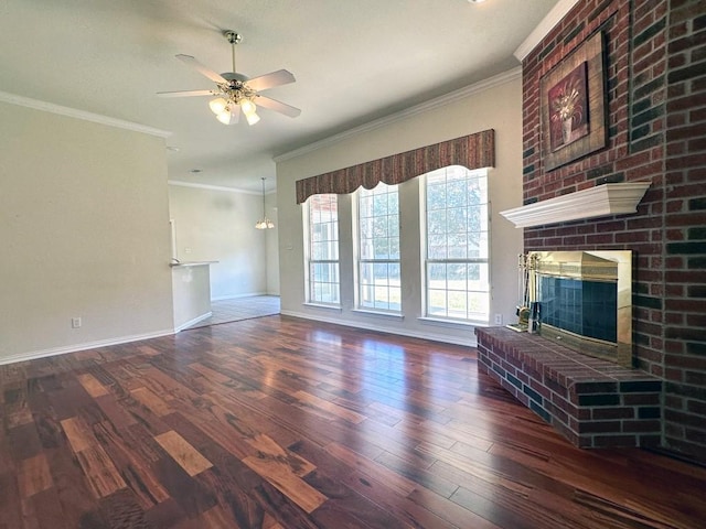 unfurnished living room featuring ornamental molding, a brick fireplace, ceiling fan, and dark wood-type flooring