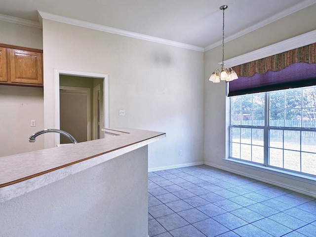 kitchen featuring ornamental molding, sink, light tile patterned floors, decorative light fixtures, and a chandelier