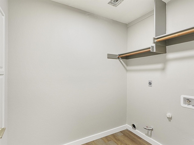 laundry room featuring gas dryer hookup, hookup for an electric dryer, hookup for a washing machine, and hardwood / wood-style floors