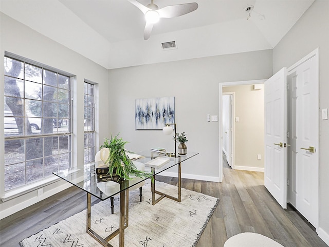 home office featuring ceiling fan, lofted ceiling, and hardwood / wood-style flooring