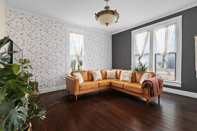 living room featuring dark hardwood / wood-style floors, crown molding, and a healthy amount of sunlight