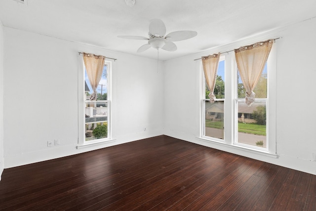 unfurnished room with hardwood / wood-style flooring, ceiling fan, and a healthy amount of sunlight