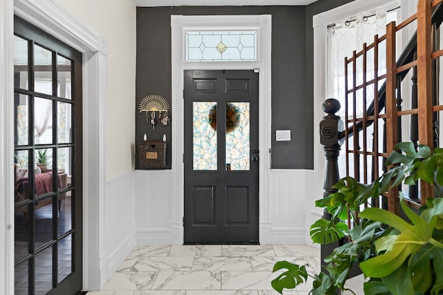 foyer featuring plenty of natural light and french doors