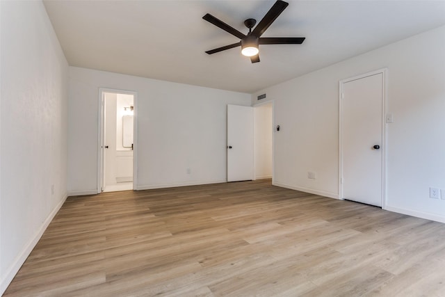 unfurnished bedroom featuring ensuite bathroom, ceiling fan, and light hardwood / wood-style floors