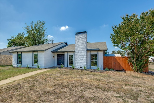 ranch-style house featuring a front lawn