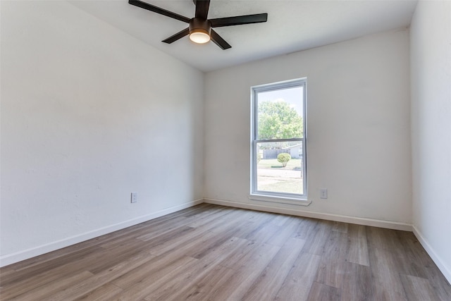 unfurnished room with ceiling fan and light wood-type flooring