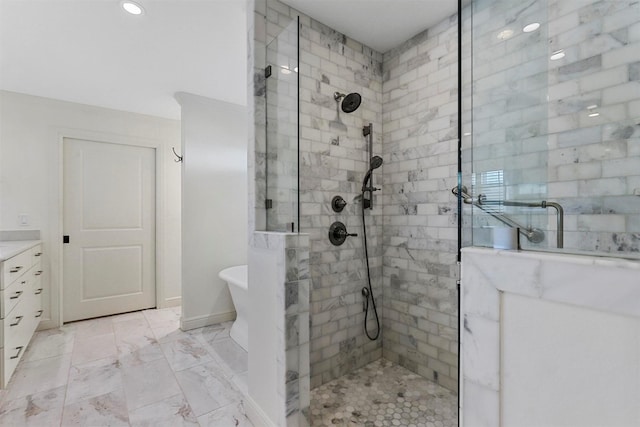 bathroom with vanity and separate shower and tub