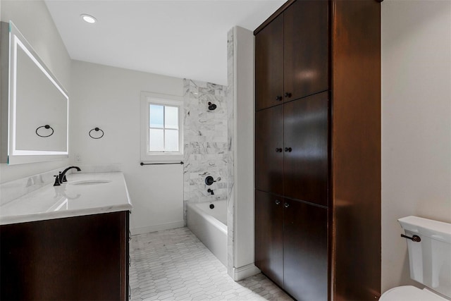 full bathroom featuring tile patterned flooring, vanity, toilet, and tiled shower / bath