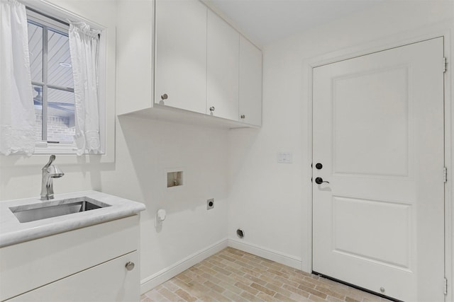 washroom featuring sink, hookup for a washing machine, cabinets, and hookup for an electric dryer