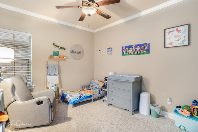 carpeted bedroom with ceiling fan and crown molding