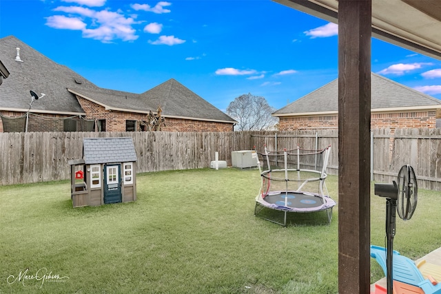 view of yard featuring a trampoline