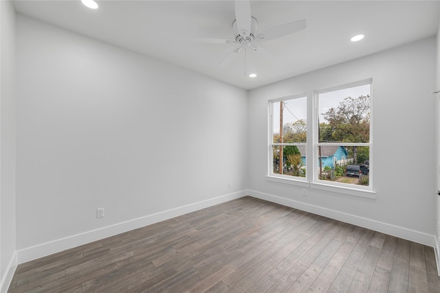 unfurnished room featuring dark hardwood / wood-style floors and ceiling fan