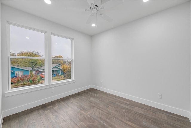 empty room featuring ceiling fan and wood-type flooring