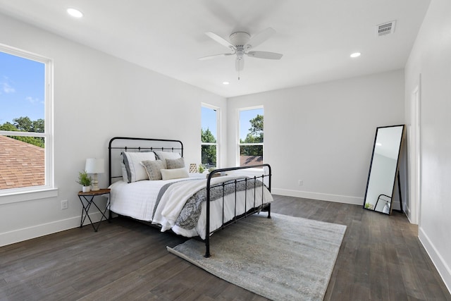 bedroom with ceiling fan and dark wood-type flooring