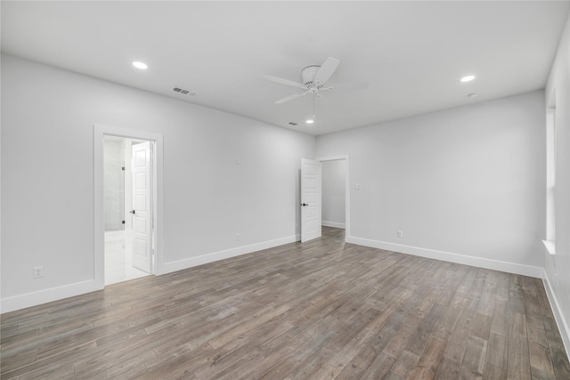 unfurnished room with hardwood / wood-style floors and ceiling fan