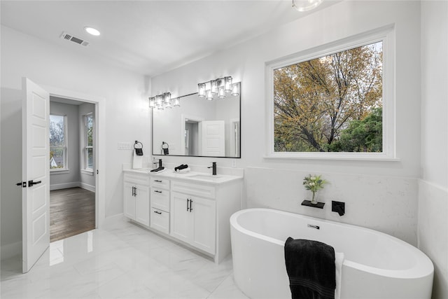 bathroom featuring a bathing tub and vanity