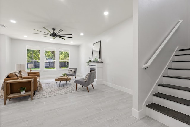 sitting room with ceiling fan