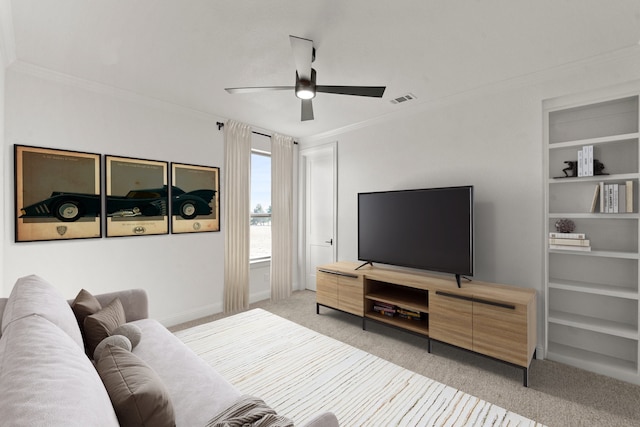 living room featuring ceiling fan, light colored carpet, and crown molding