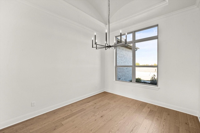 unfurnished dining area featuring lofted ceiling, an inviting chandelier, light hardwood / wood-style floors, and a healthy amount of sunlight