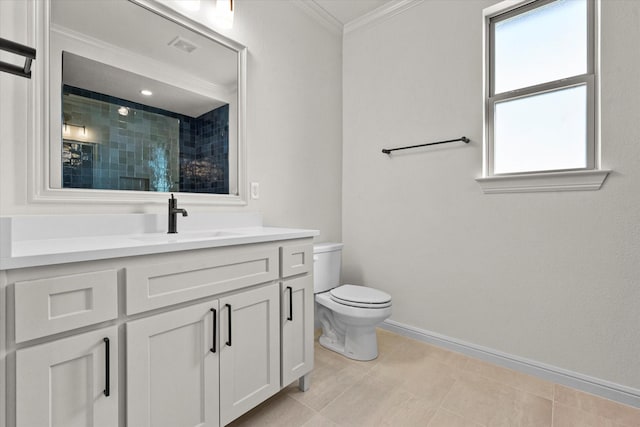 bathroom with a healthy amount of sunlight, a tile shower, crown molding, and vanity