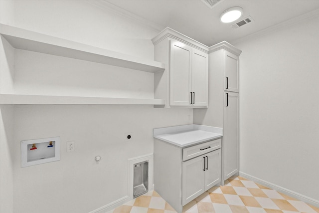 laundry room featuring washer hookup, crown molding, cabinets, and hookup for an electric dryer