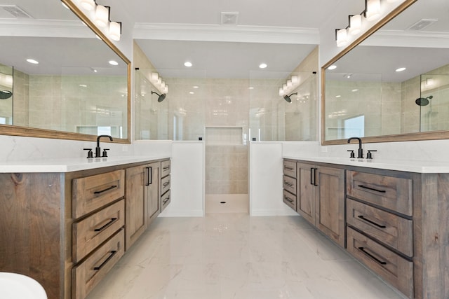 bathroom with a tile shower, ornamental molding, and vanity