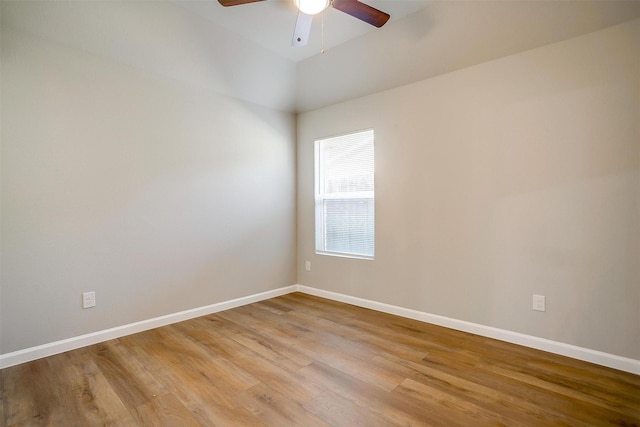 empty room featuring ceiling fan and light hardwood / wood-style flooring