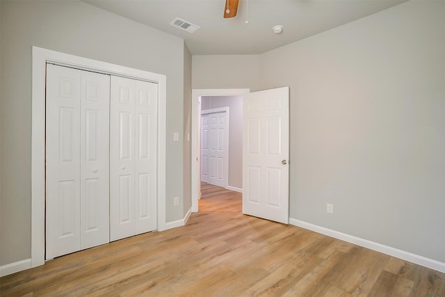 unfurnished bedroom with a closet, ceiling fan, and light wood-type flooring