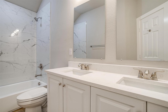 full bathroom with vanity, toilet, and tiled shower / bath