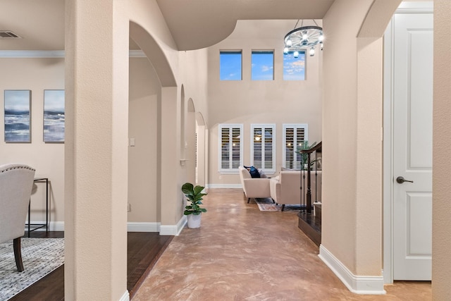 entrance foyer featuring a chandelier and wood-type flooring