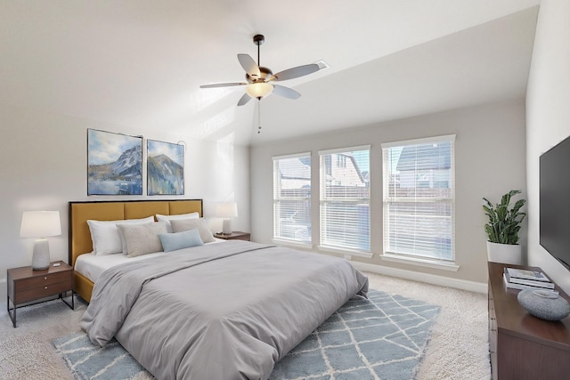 carpeted bedroom featuring vaulted ceiling and ceiling fan