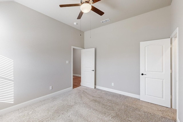 unfurnished bedroom featuring carpet floors and ceiling fan