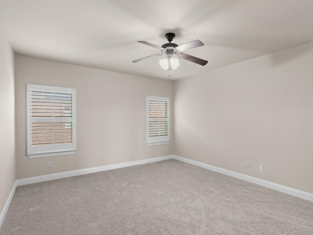 unfurnished room with ceiling fan and carpet floors