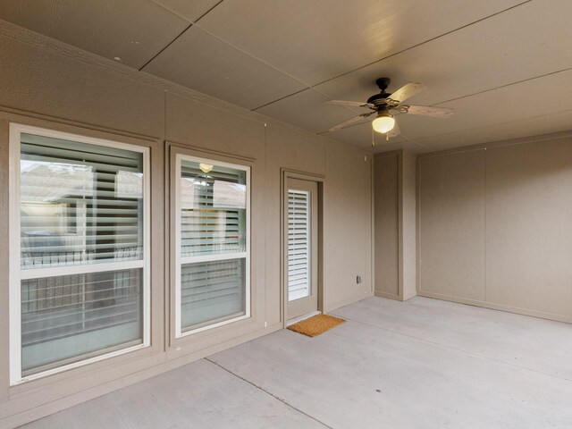 exterior space featuring ceiling fan