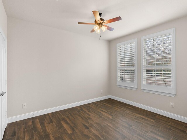 unfurnished room featuring ceiling fan and dark hardwood / wood-style floors