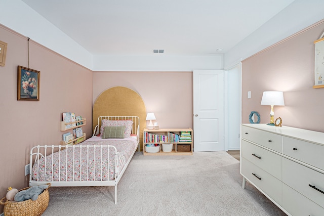 bedroom with light carpet