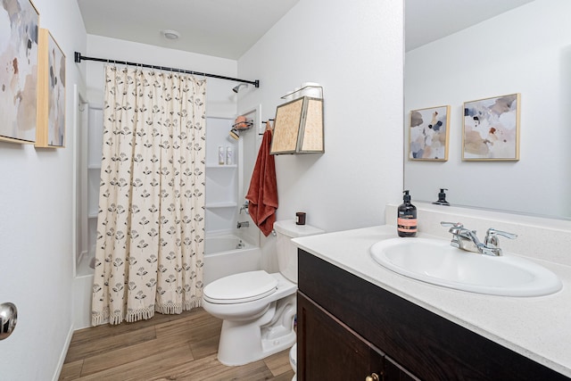 full bathroom featuring hardwood / wood-style floors, vanity, toilet, and shower / bath combination with curtain