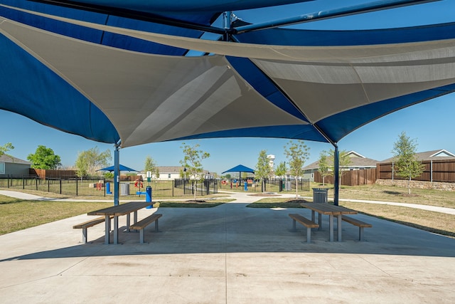 view of home's community with a yard and a playground