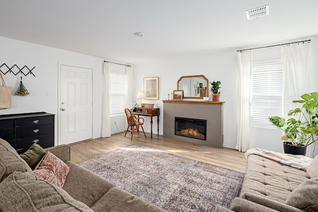 living room with light hardwood / wood-style floors