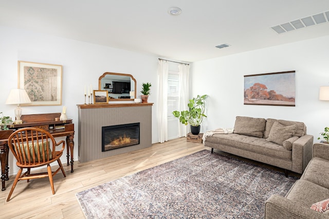 living room with light hardwood / wood-style floors