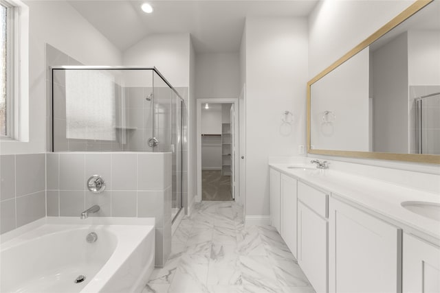 bathroom featuring a sink, double vanity, a shower stall, marble finish floor, and a garden tub