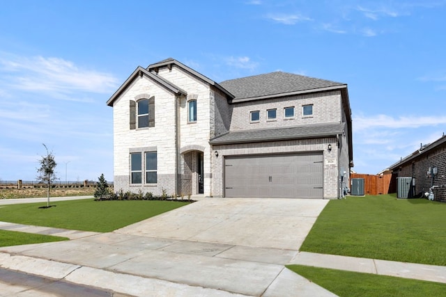 traditional home with an attached garage, a front lawn, cooling unit, and roof with shingles