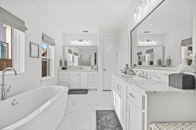 bathroom with a bath and vanity