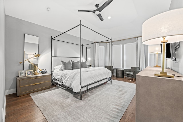 bedroom with ceiling fan and dark hardwood / wood-style flooring