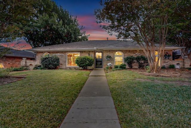 view of front of property with a lawn