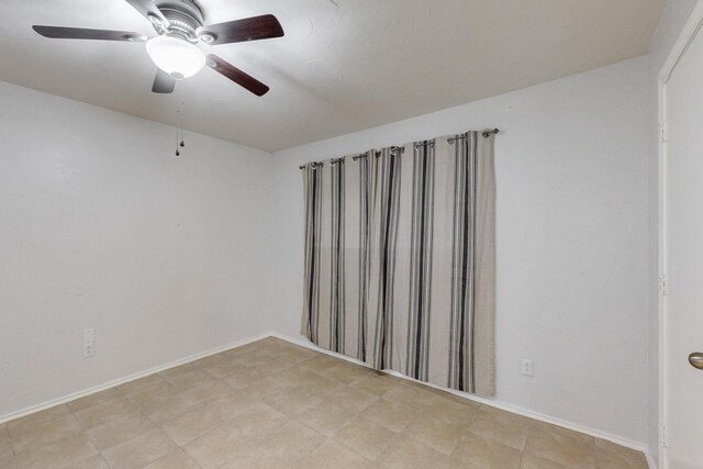 unfurnished room featuring ceiling fan