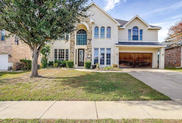 view of front of home featuring a front lawn and a garage